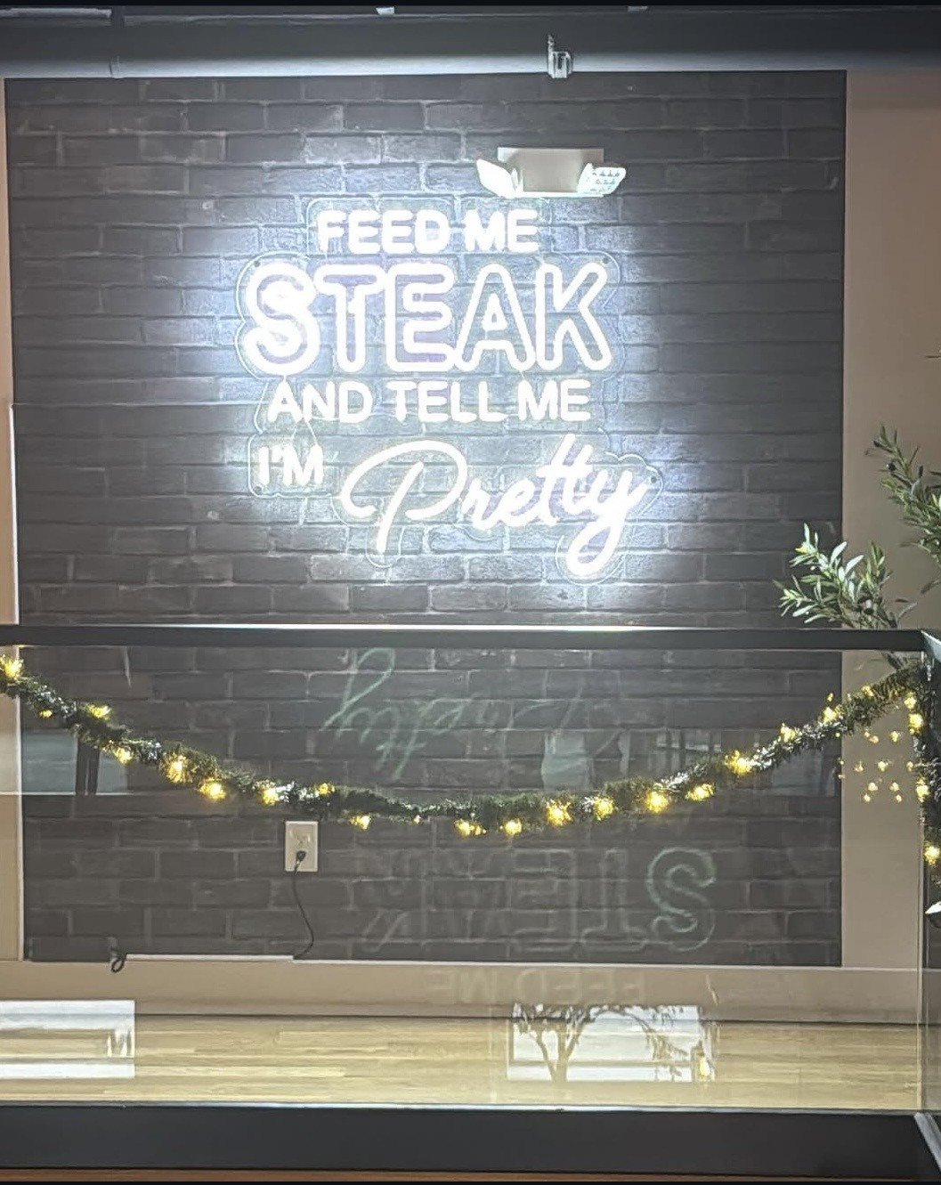 'Feed me steak and tell me I'm pretty' sign at Allendale Steakhouse